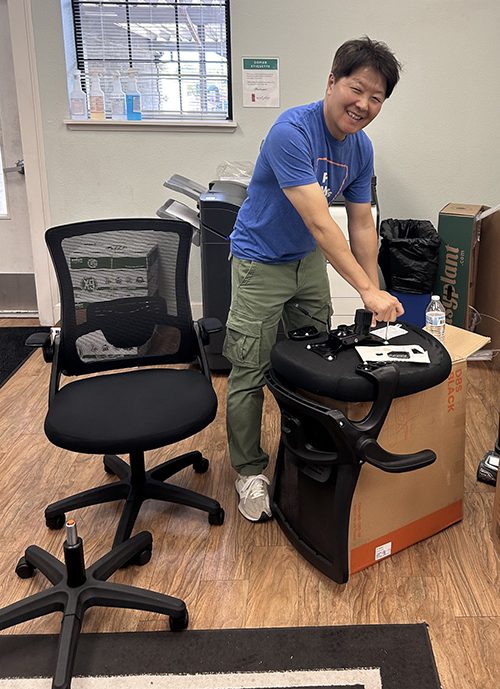 SVP Internal Audit Sun Park assembles office furniture at Saint John's Program for Real Change_500px