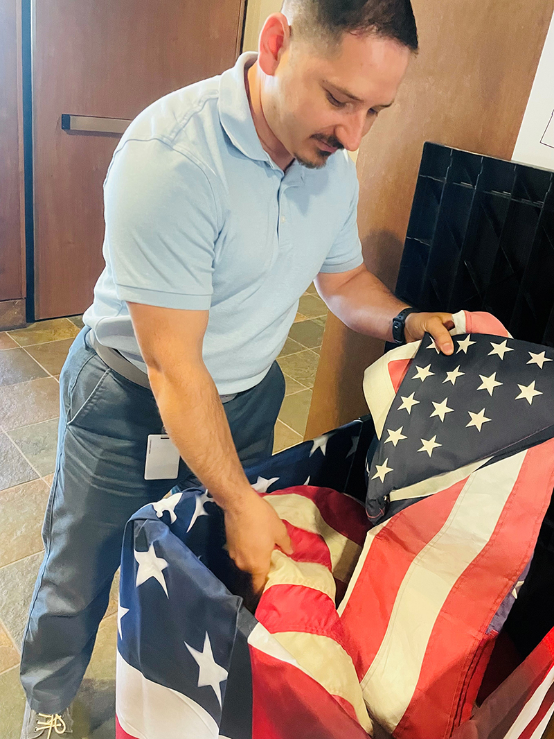 VALOR Executive Sponsor Robert Paduano sorts collected U.S. flags for flag collection_2_800px