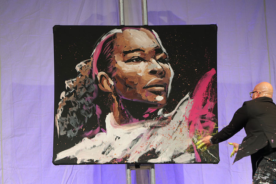 Performance artist David Garibaldi painted a portrait of tennis legend Serena Williams at the SAFE Credit Union Convention Center.