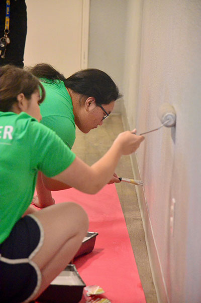 SAFE Credit Union interns Evan Mova and Nicole Vasques update a classroom with a fresh coat of
paint.