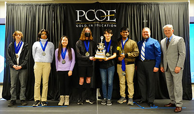 Placer County Academic Decathlon first-place winners from Rocklin High School with their coach, Michael Knight, and SAFE Credit Union Board Chair Terry Tremelling.